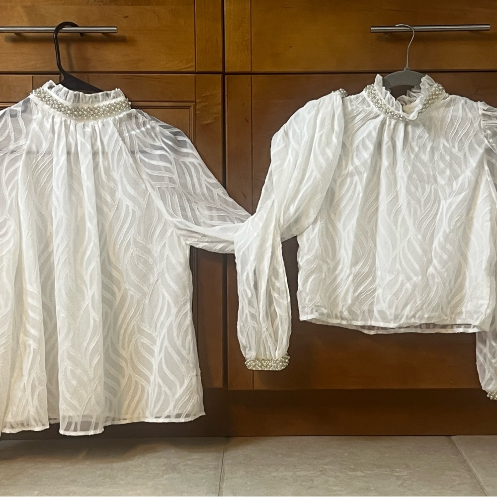 Matching Mom and daughter blouses .
